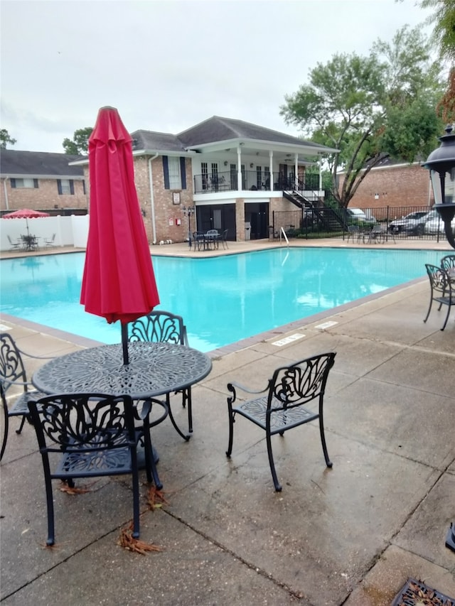 view of pool featuring a patio area