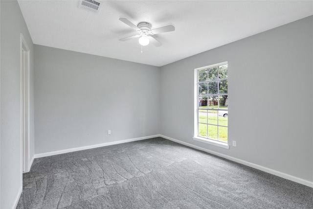 carpeted empty room featuring ceiling fan