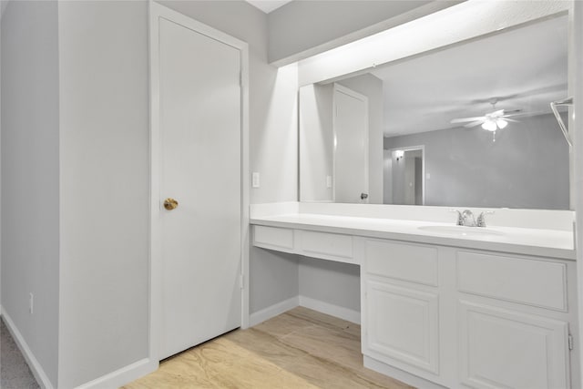 bathroom with vanity, wood-type flooring, and ceiling fan