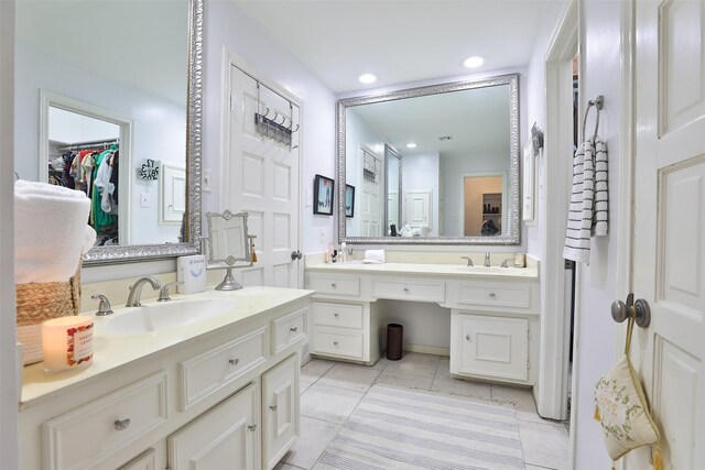 bathroom with tile patterned floors and vanity