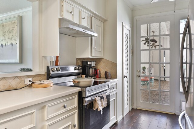 kitchen featuring dark hardwood / wood-style floors, range hood, crown molding, and stainless steel electric range