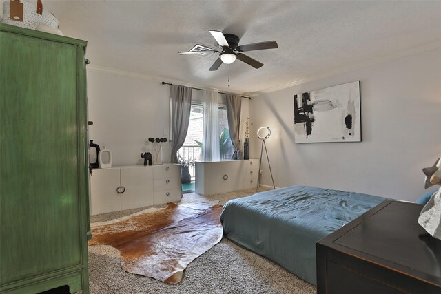 bedroom featuring carpet flooring, ceiling fan, crown molding, and a textured ceiling