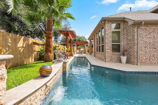 view of pool with a patio area and a pergola