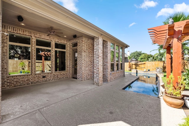 view of patio with a fenced in pool, ceiling fan, and a pergola