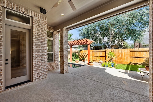 view of patio / terrace with a pergola and ceiling fan