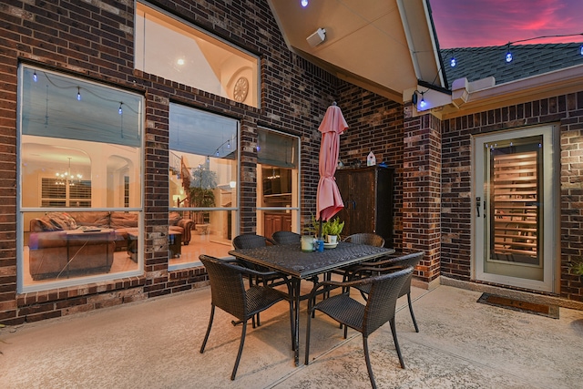 view of patio terrace at dusk