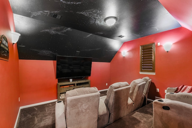 carpeted cinema featuring lofted ceiling