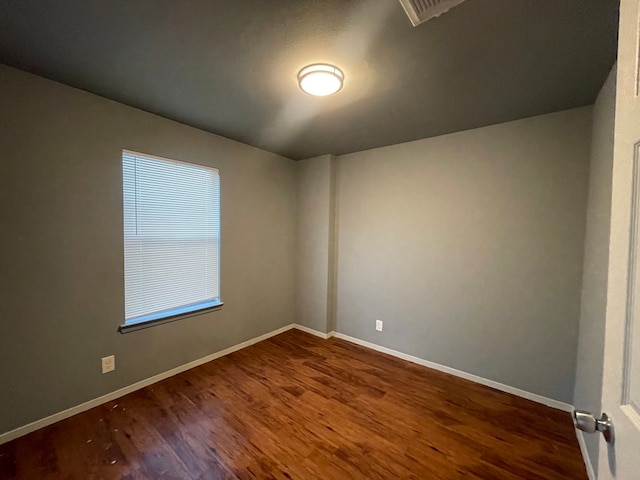 empty room with hardwood / wood-style floors