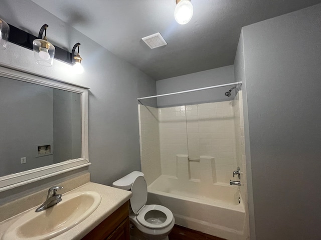 full bathroom featuring vanity, toilet, and bathtub / shower combination