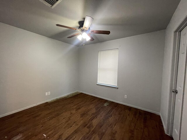 empty room with hardwood / wood-style flooring and ceiling fan