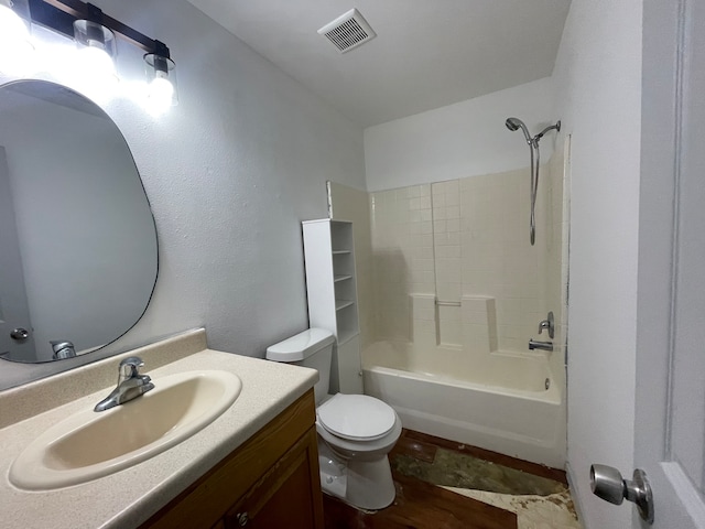 full bathroom with vanity, toilet, tile patterned floors, and washtub / shower combination