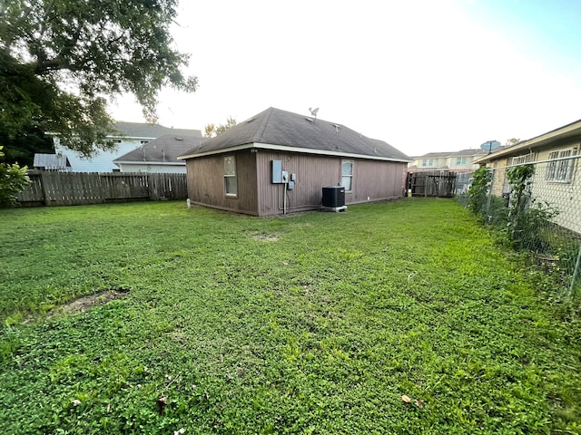 view of yard with central AC