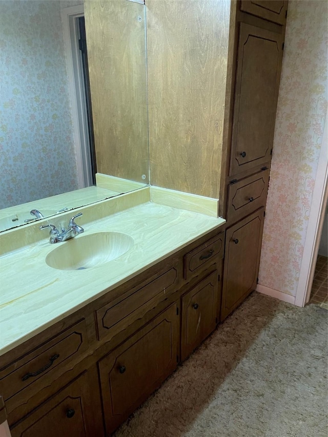 1055 County Road 452, Sweeny, TX 77480 - bathroom featuring baseboards, vanity, and wallpapered walls