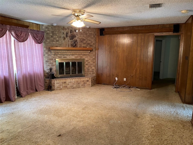 1055 County Road 452, Sweeny, TX 77480 - unfurnished living room with a textured ceiling, visible vents, carpet floors, and ceiling fan