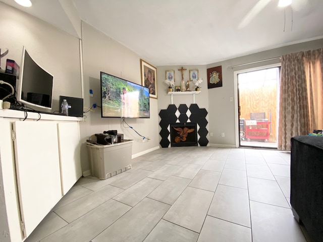 living room with light tile patterned floors and ceiling fan