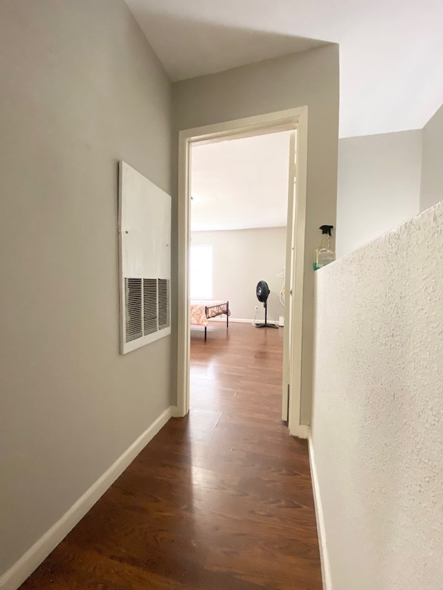 hallway featuring dark hardwood / wood-style floors