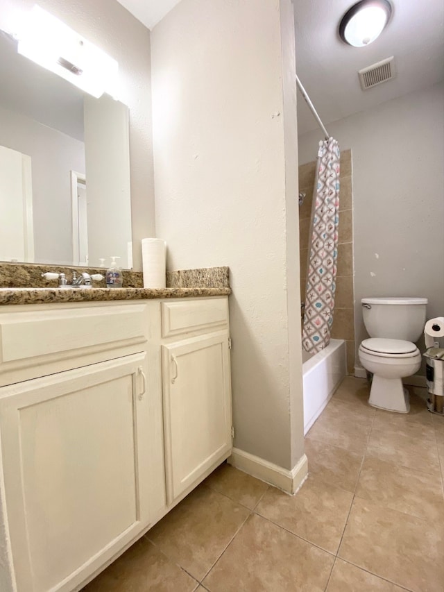 full bathroom with tile patterned floors, vanity, toilet, and shower / bath combo