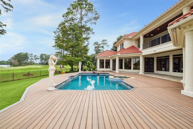 view of swimming pool with a yard