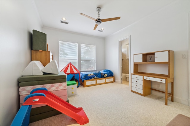 playroom featuring carpet floors, crown molding, and ceiling fan