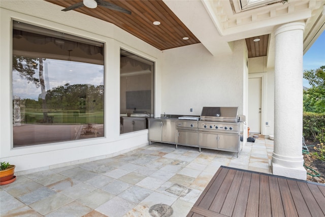 exterior space with grilling area, a patio area, and ceiling fan