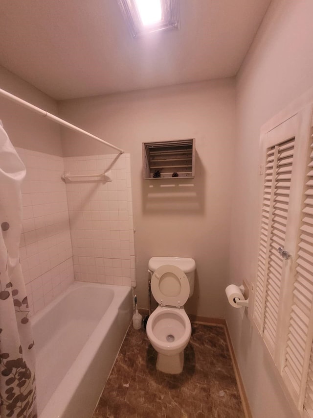 bathroom with toilet, shower / bath combo with shower curtain, and tile patterned floors