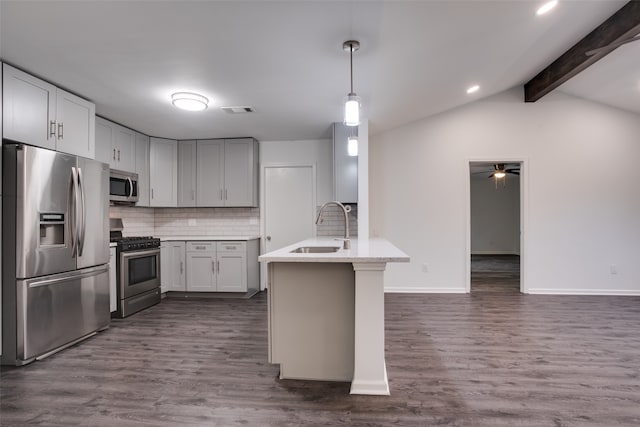 kitchen featuring sink, stainless steel appliances, vaulted ceiling with beams, dark hardwood / wood-style floors, and backsplash