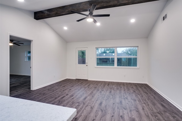 empty room featuring dark hardwood / wood-style floors, lofted ceiling with beams, and ceiling fan