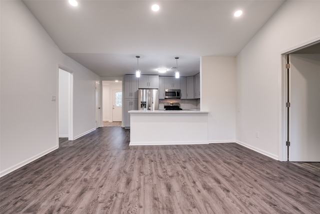 unfurnished living room with dark hardwood / wood-style floors