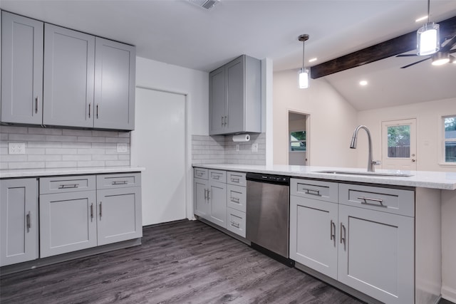 kitchen with stainless steel dishwasher, dark hardwood / wood-style floors, sink, and tasteful backsplash