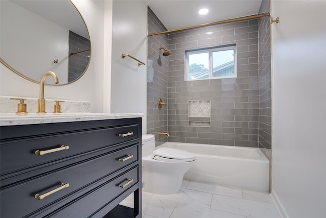 full bathroom featuring vanity, tiled shower / bath combo, and toilet