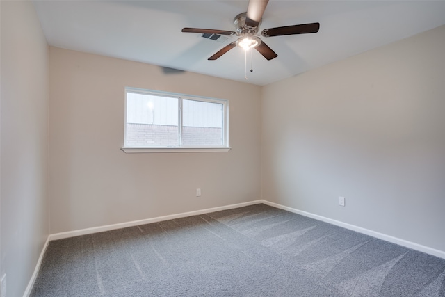 unfurnished room featuring ceiling fan and carpet