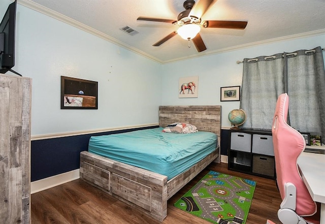 bedroom with a textured ceiling, ornamental molding, dark hardwood / wood-style floors, and ceiling fan