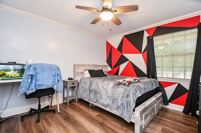 bedroom with a textured ceiling, ornamental molding, hardwood / wood-style floors, and ceiling fan