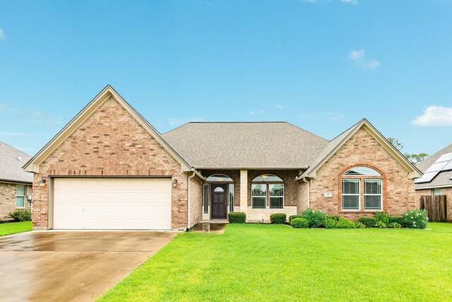 front facade with a garage and a front yard