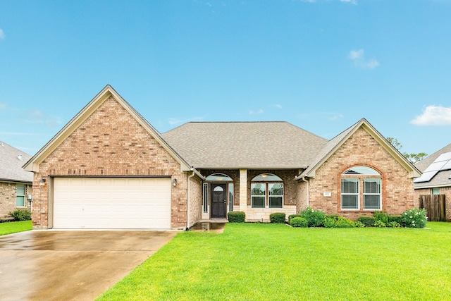 view of front property with a front lawn and a garage