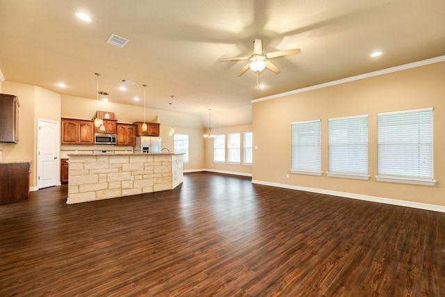 unfurnished living room featuring ceiling fan, dark hardwood / wood-style flooring, and ornamental molding