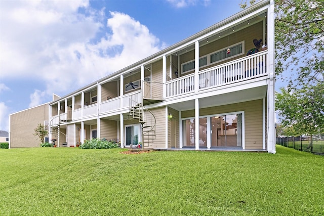 back of property featuring a yard