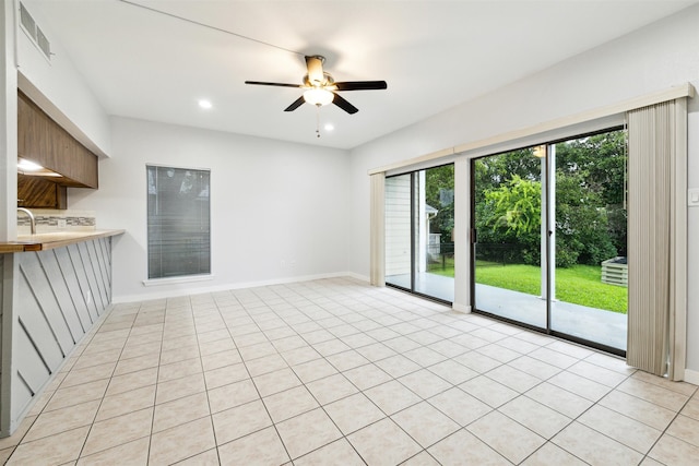 interior space featuring ceiling fan