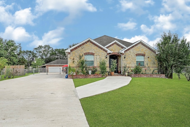 view of front of property featuring a garage and a front yard