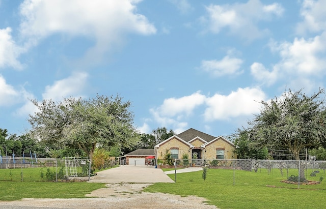 view of front facade with a garage and a front yard