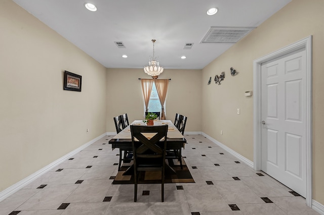 dining area with a notable chandelier and light tile patterned flooring