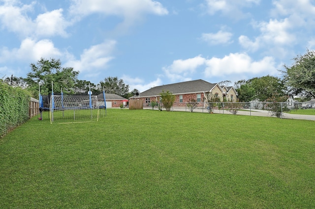 view of yard with a trampoline