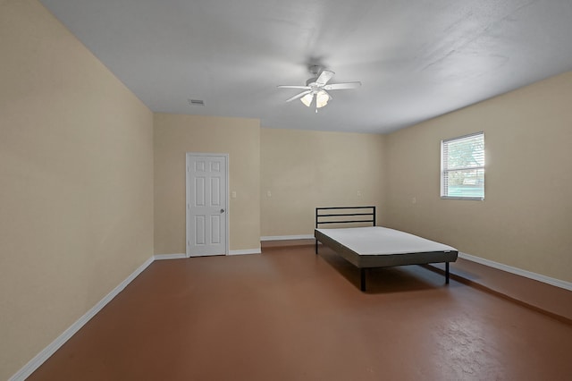 unfurnished bedroom featuring concrete flooring and ceiling fan