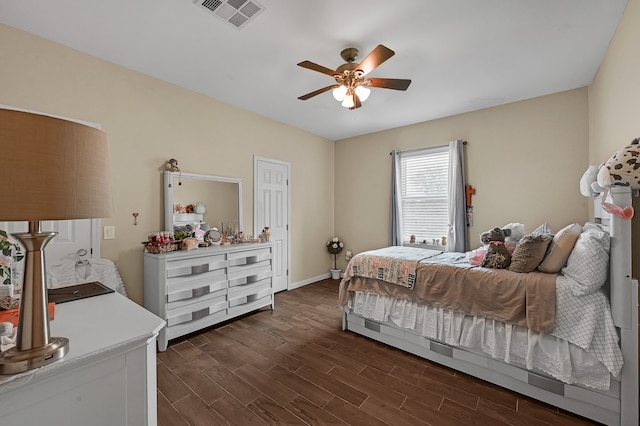 bedroom with dark wood-type flooring and ceiling fan