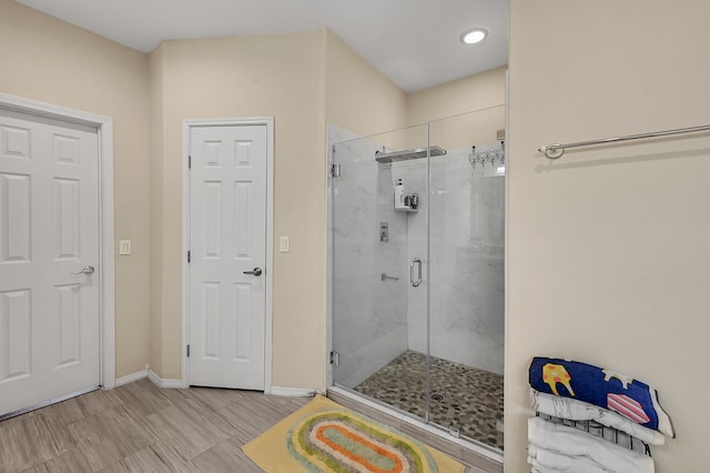 bathroom with walk in shower and tile patterned floors