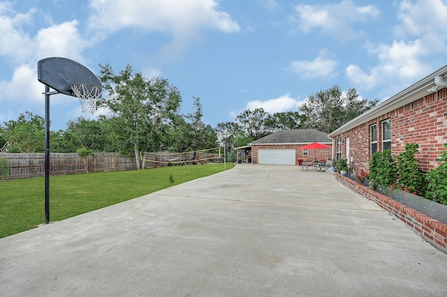 exterior space featuring a garage and a lawn