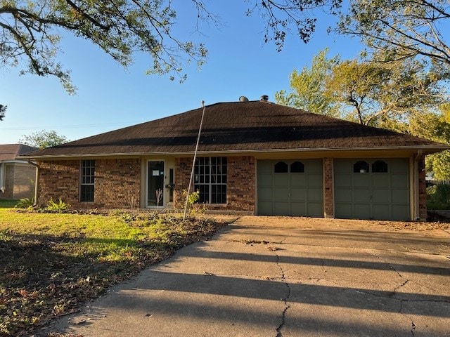 ranch-style house featuring a garage