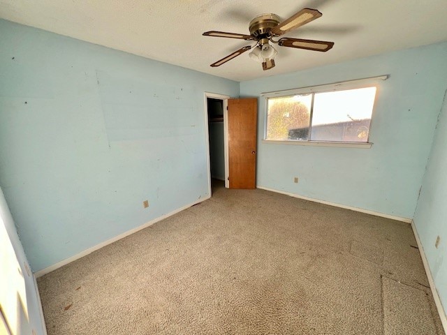 unfurnished bedroom with light carpet and ceiling fan