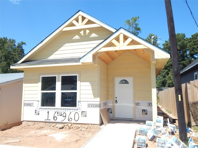 view of front of home with fence