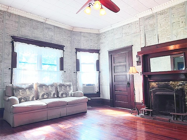 living room with crown molding, hardwood / wood-style floors, ceiling fan, and cooling unit